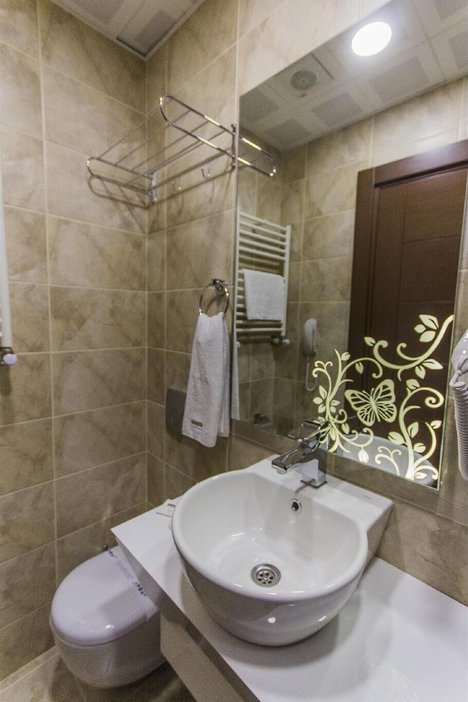 Deluxe Double Room, Balcony | Bathroom | Shower, hair dryer, slippers, towels