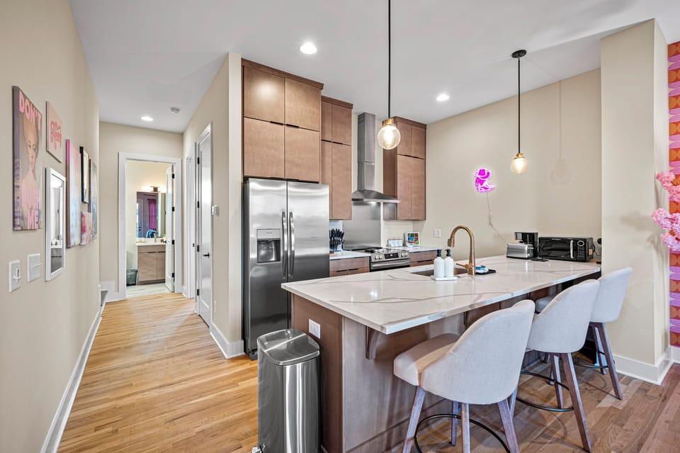 Gather around the spacious island for breakfast, coffee, or late-night snacks. The open layout makes it easy to cook, connect, and spend time together.