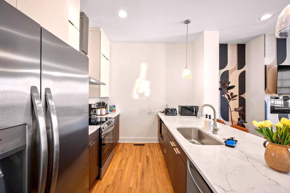 Cook, snack, or gather around the spacious waterfall island while enjoying a fully equipped kitchen stocked for everything from quick breakfasts to family dinners.