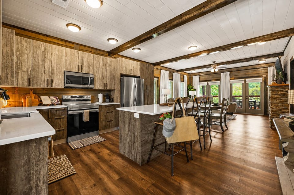 Open kitchen with generous prep space and island seating, so the cook can stay part of the conversation.