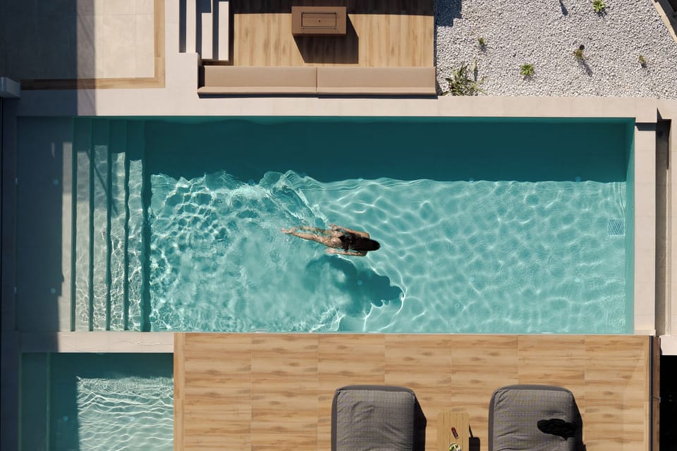 Begin each morning beside private waters overlooking Bali’s natural surroundings