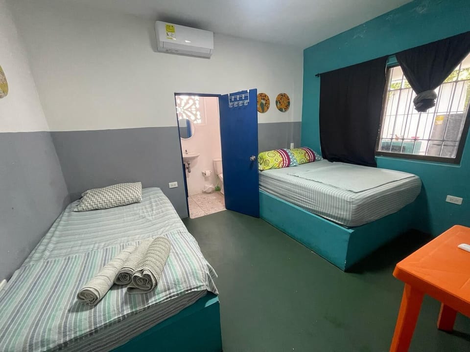 Economy Triple Room | Laptop workspace, blackout drapes, WiFi (free)