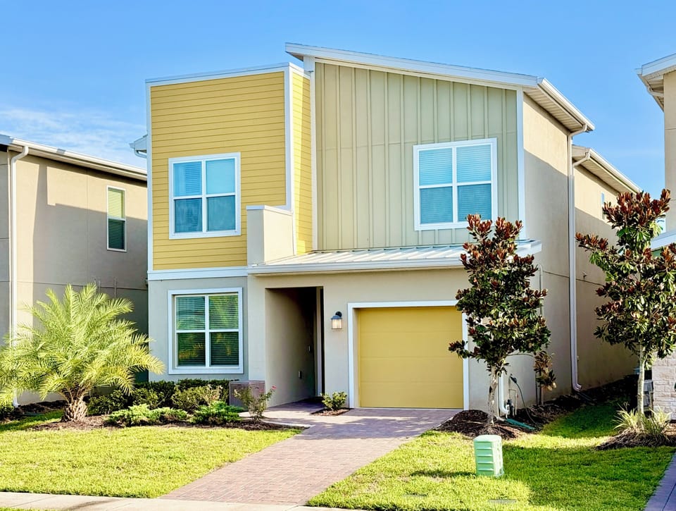 Welcome to your modern vacation home! Two-story design with yellow accents.