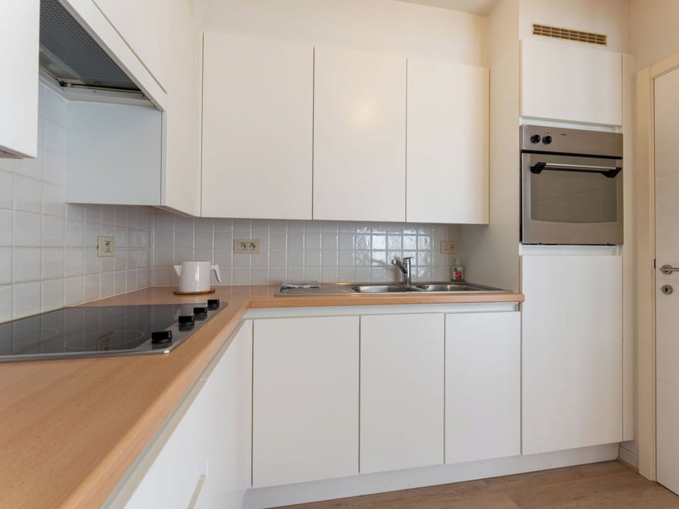 Kitchen, Kitchen Appliance, Countertop, Major Appliance, Interior Design, Wood, Cabinetry, Flooring, Kitchen Stove, Kitchen Sink