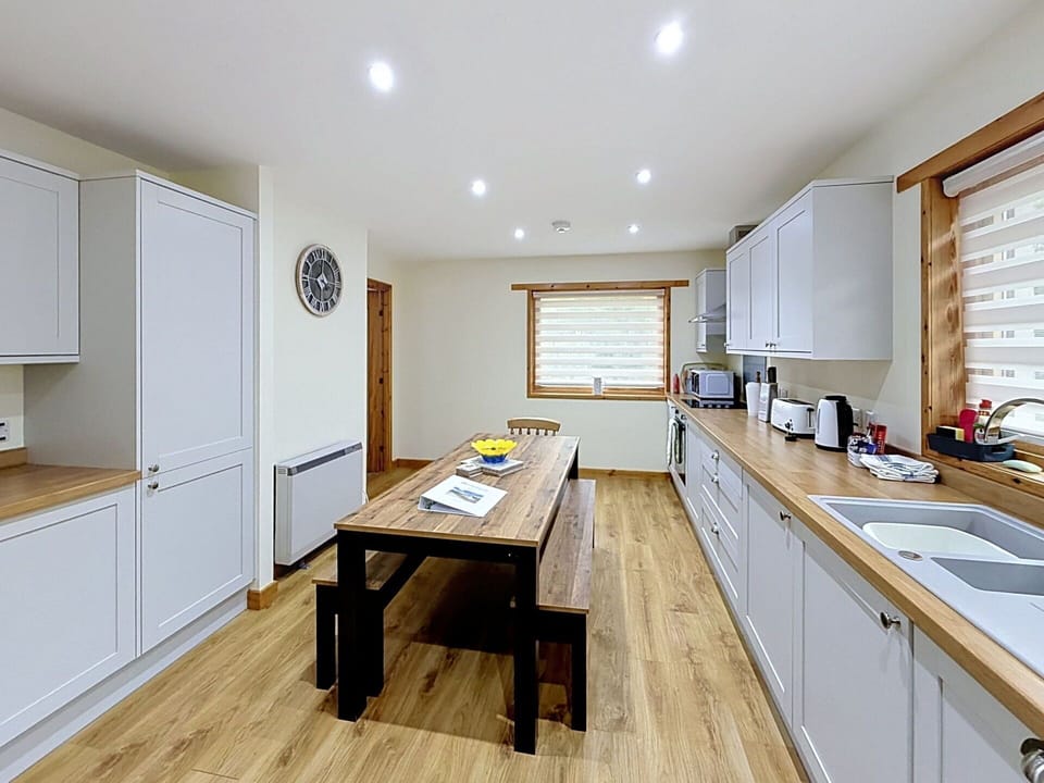 Furniture, Interior Design, Wood, Flooring, Ceiling, Countertop, Cabinetry, Kitchen, Floor, Lighting