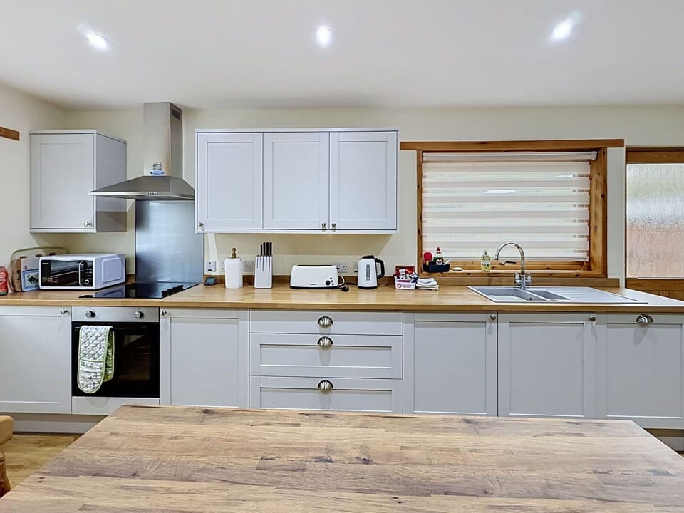 Kitchen, Furniture, Countertop, Kitchen Appliance, Cabinetry, Interior Design, Wood, Flooring, Home Appliance, Major Appliance