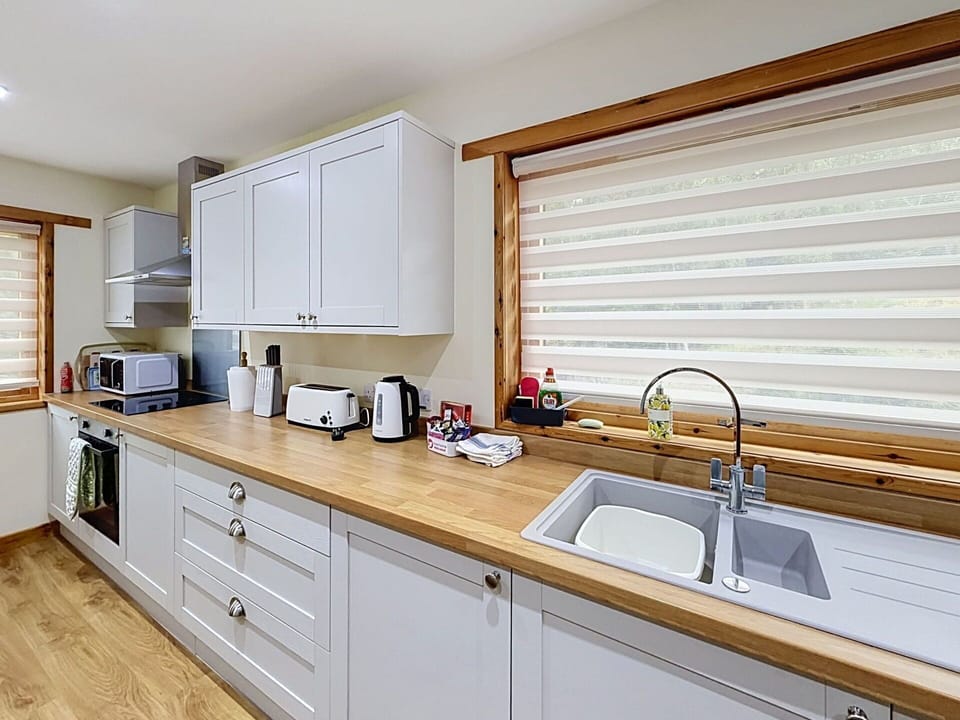 Interior Design, Wood, Kitchen, Countertop, Flooring, Plumbing Fixture, Home, Cabinetry, Furniture, Floor
