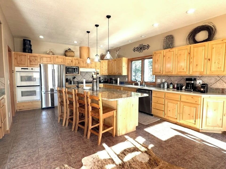 Plenty of extra cooking amenities, to include double oven, full refrigerator, dishwasher, microwave, coffee maker, and stove top.