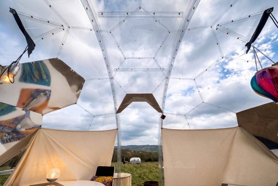 Gaze up through the transparent dome at ever changing skies