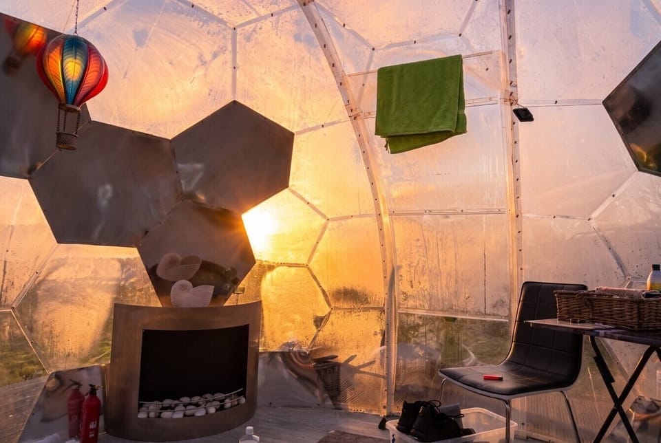 Sunlight streams in as the dome glows golden at dawn
