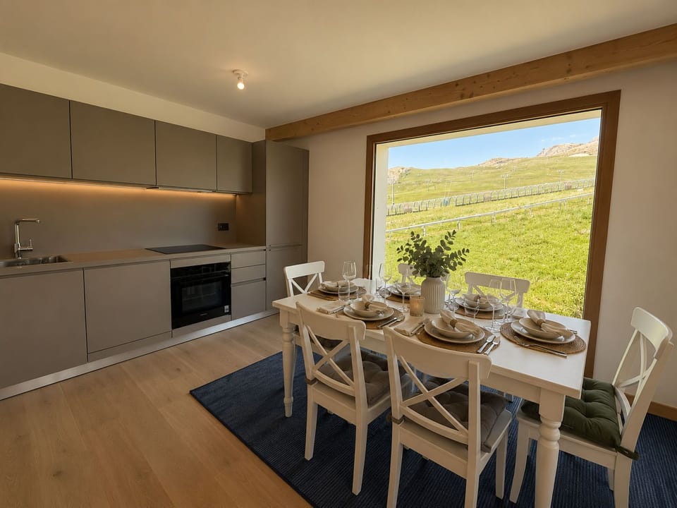 Prepare meals with mountain views, then gather around the dining table to share them.