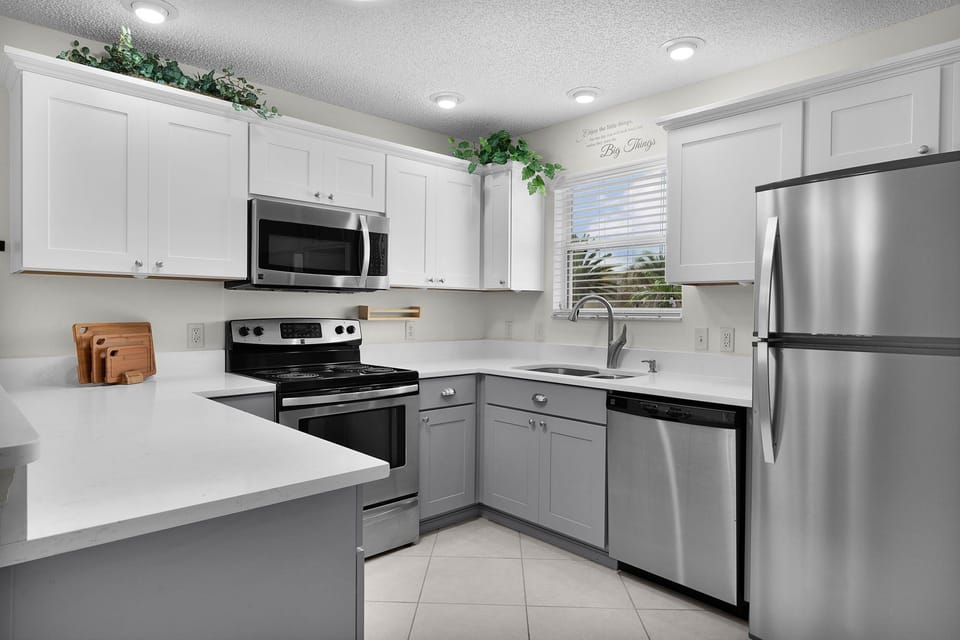 Your fully equipped kitchen makes meal prep a breeze with sleek stainless steel appliances, ample counter space, and everything you need to cook up a feast.