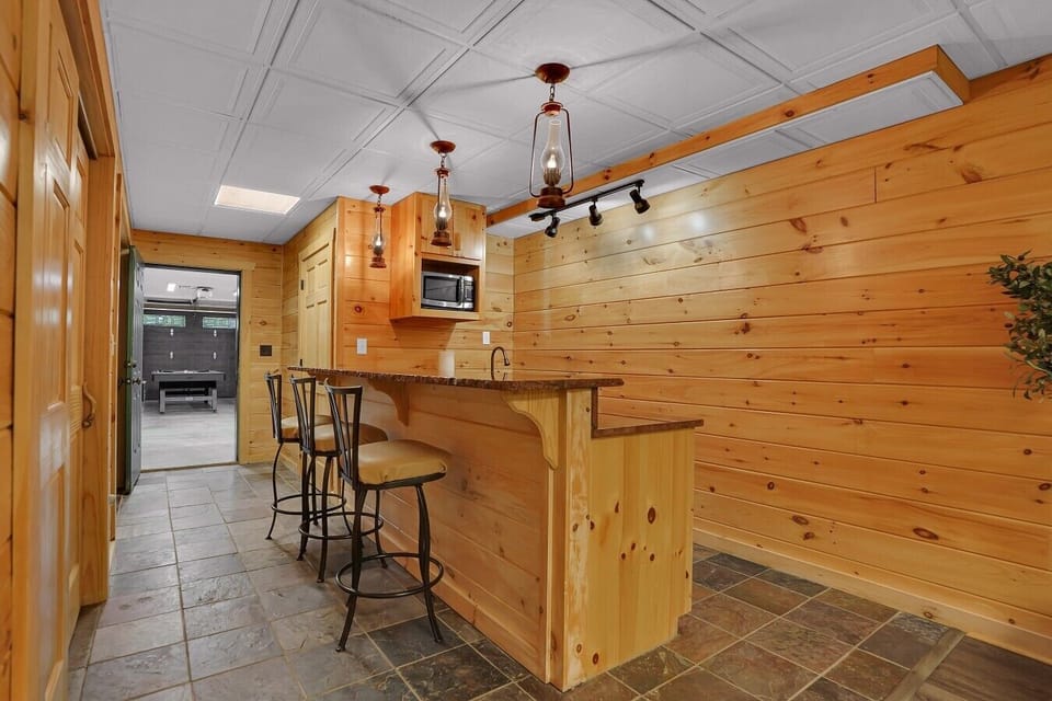 Basement Bar Area with mini-fridge and microwave