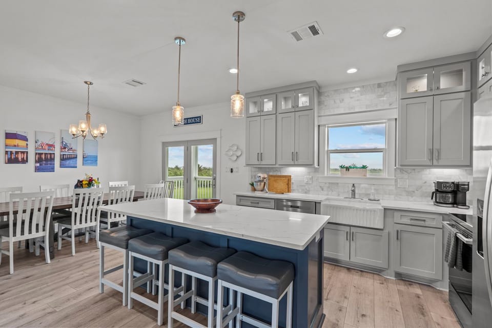 Kitchen with bar seating for 4. Dining room table seats 10.