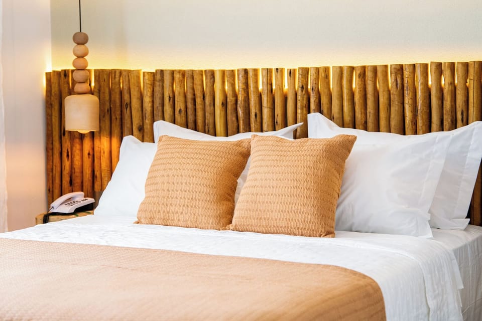 Standard Double Room, Partial Sea View | Minibar, WiFi (free), bed sheets