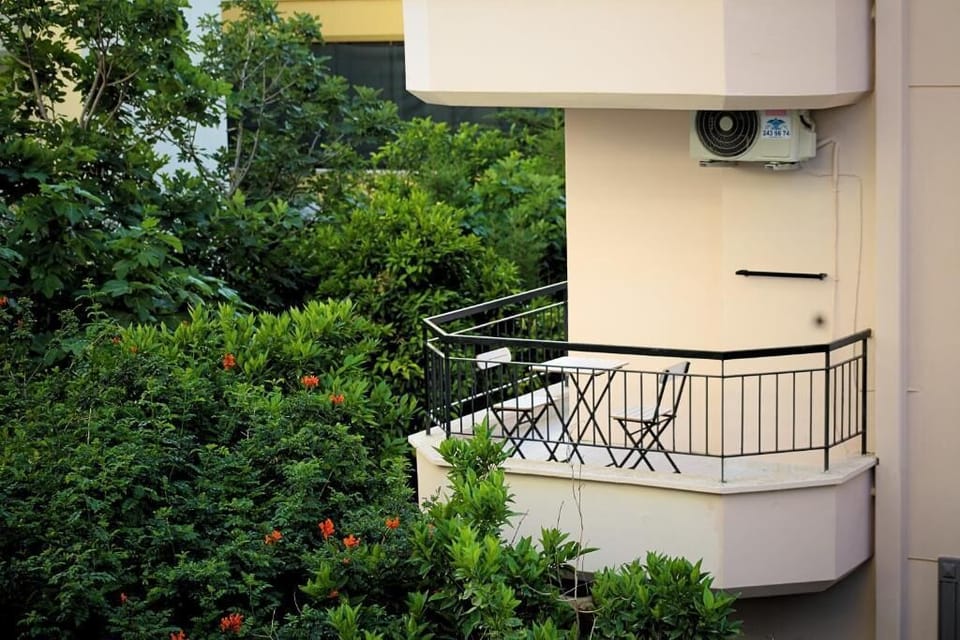 Superior Triple Room, Balcony, Garden View | Property grounds