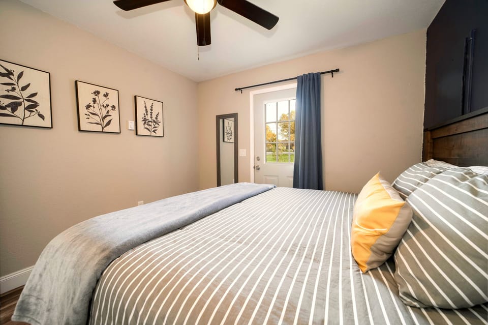 Cozy, light-filled bedroom with a plush bed and calming modern decor