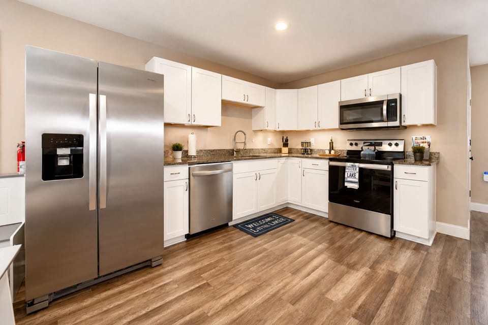Bright modern kitchen with stainless appliances and spacious layout