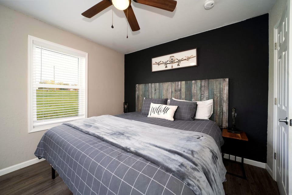 Cozy modern bedroom with rustic touches and great natural light