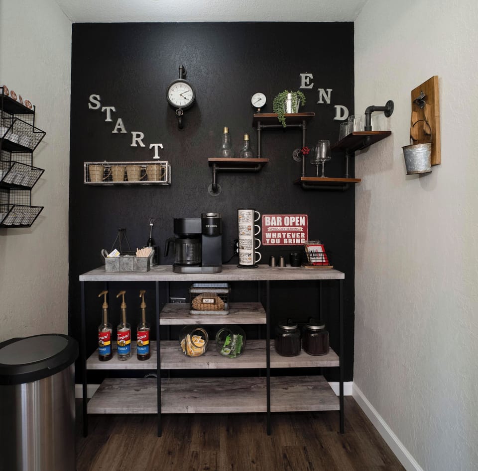 Chic coffee bar with industrial shelves and fun drink station vibes
