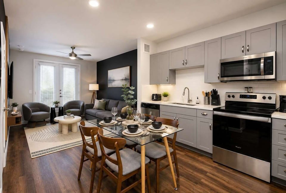 Open-concept kitchen flows seamlessly into a bright, inviting living room.