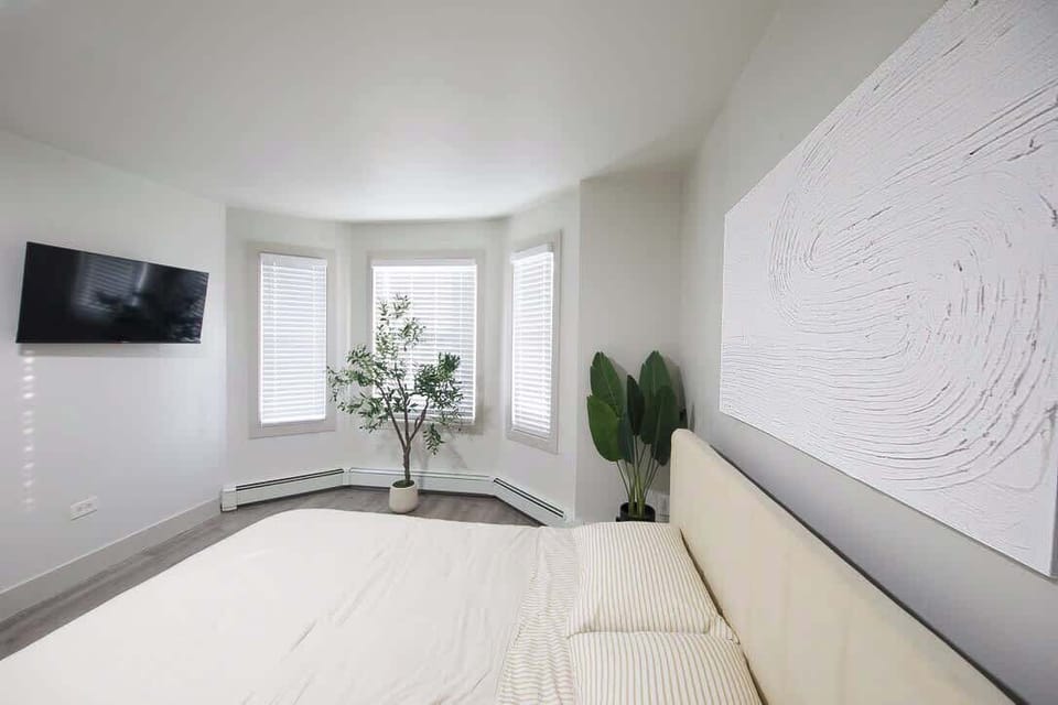 This bedroom has a smart TV with streaming apps. 