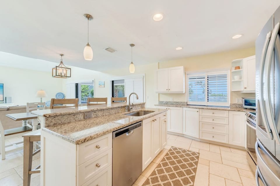 A second view of the dining area and kitchen shows more of the space.