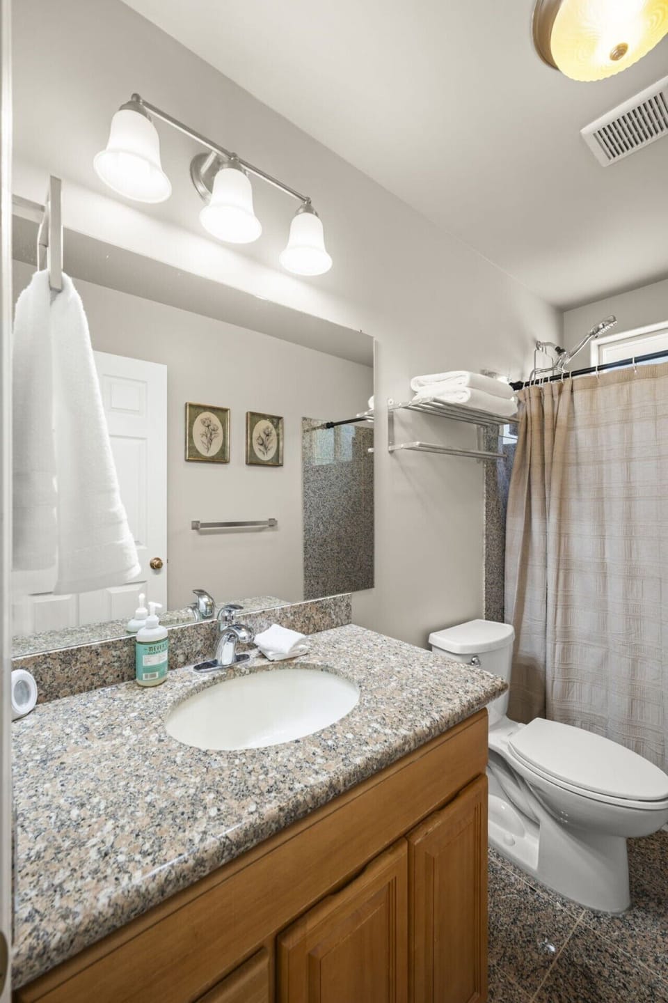 Upper Level Ensuite Bathroom :Private bathroom with a bathtub, shower, spacious vanity, fresh towels, and complimentary toiletries.