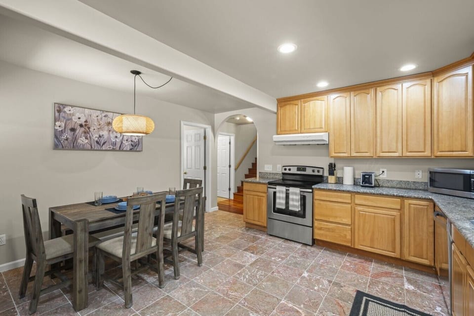Main Level: Fully equipped kitchen with stainless steel appliances, coffee maker, toaster, cookware, and everything you need to prepare meals.