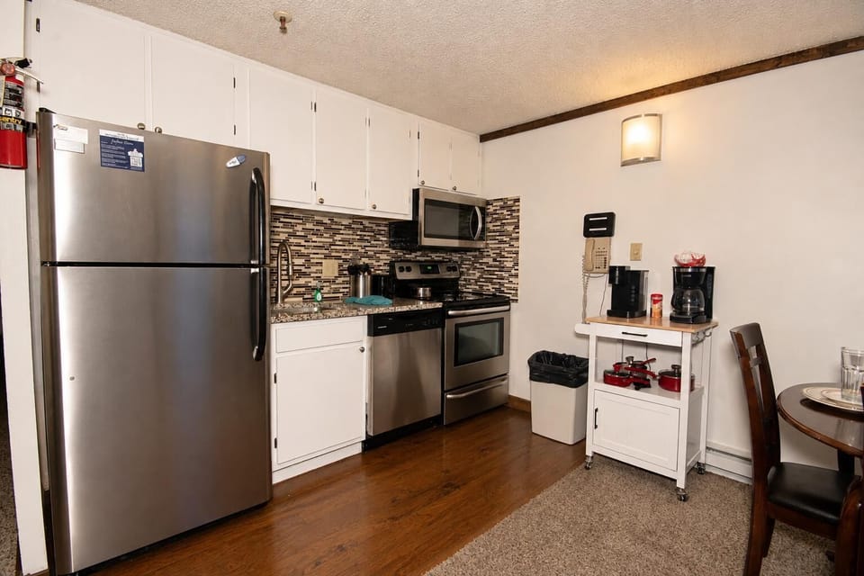 Explore the culinary possibilities in this charming, well-equipped kitchen.