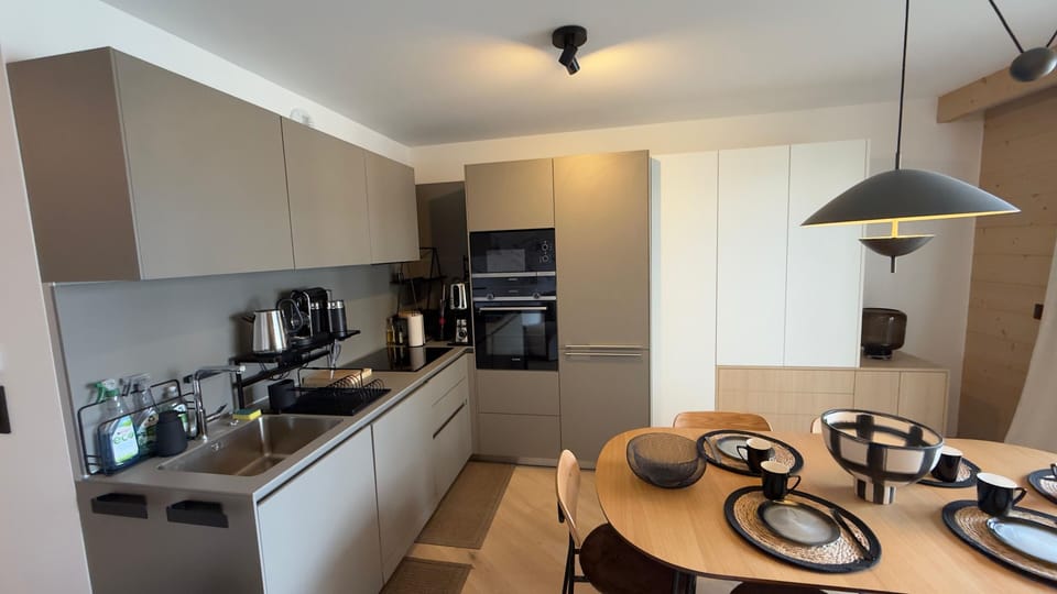 Restaurants sit a short walk away, but this fully equipped kitchen with an oven, induction hob, and Nespresso machine works just as well