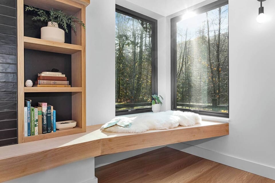 Curl up with a book in this corner window seat with tons of natural light