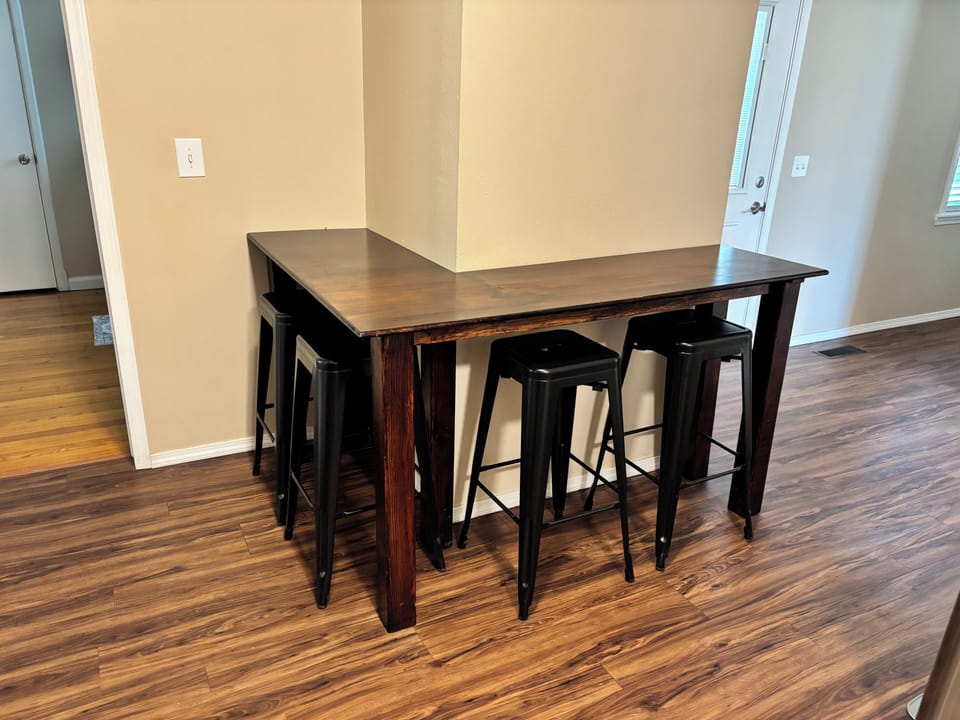 Modern pub-style dining nook with seating for four