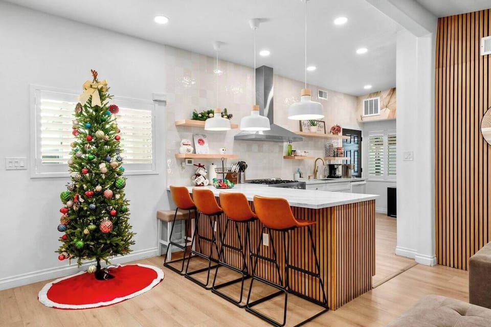 Modern kitchen features a spacious island with stylish bar seating.
