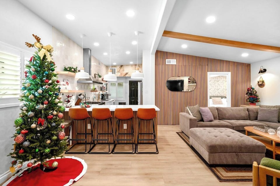 This home features an open-concept living and dining area with a modern kitchen island.