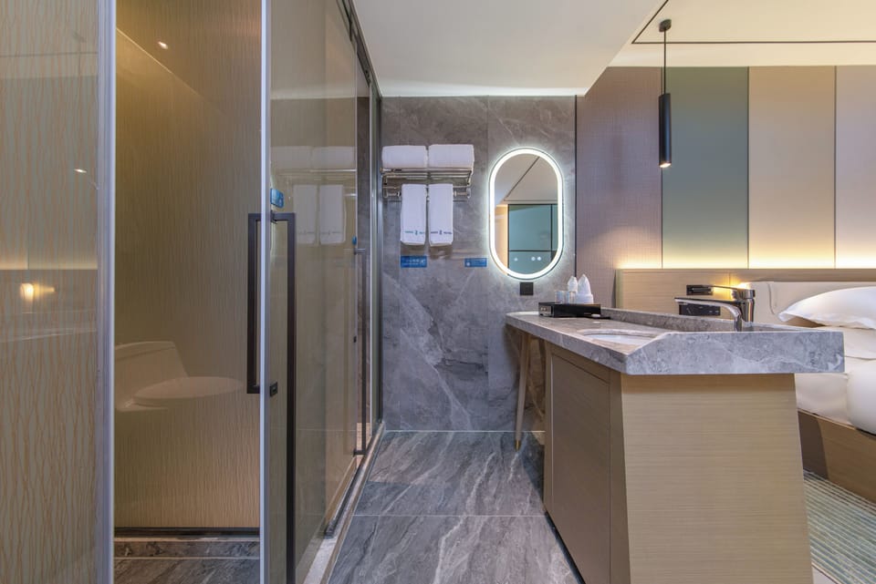 Single Room, 1 Queen Bed | Bathroom | Shower, hair dryer, towels, soap