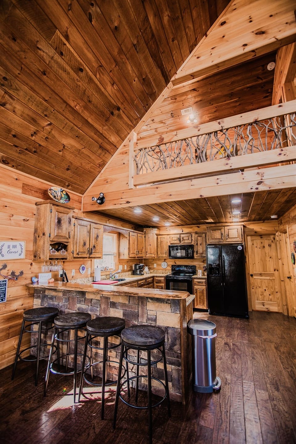 Kitchen and dining area with bar seating and cooking space