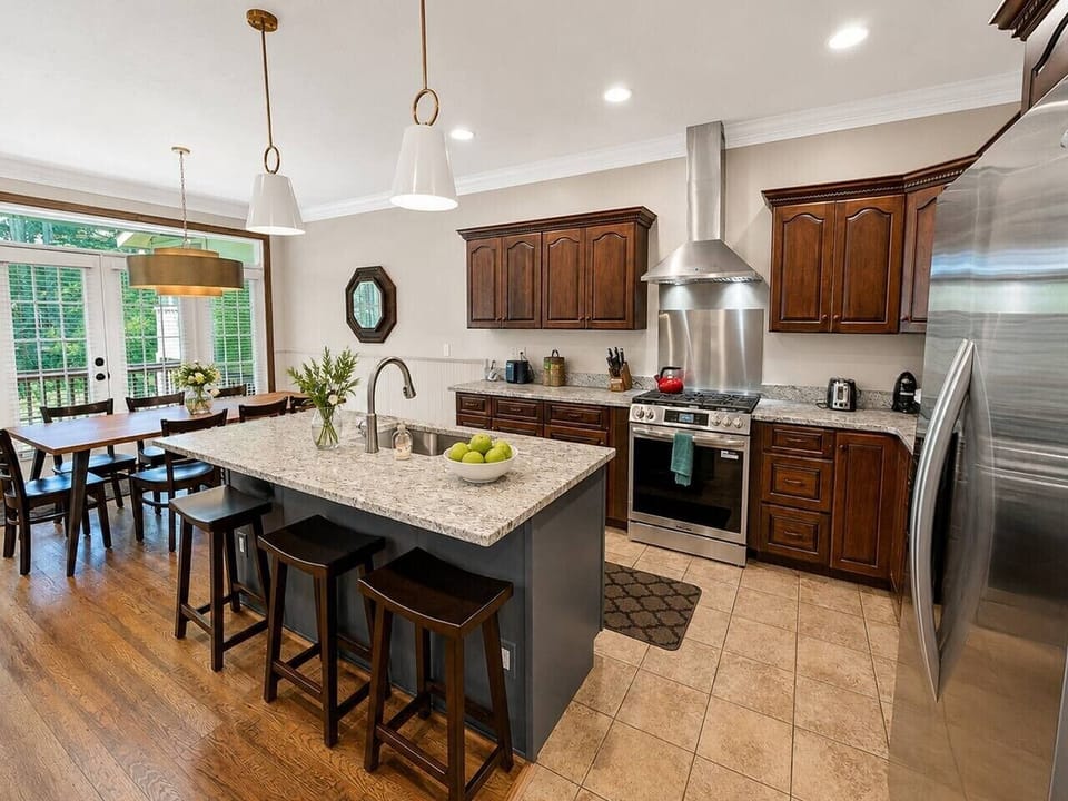 Gourmet kitchen with granite and stainless steel
