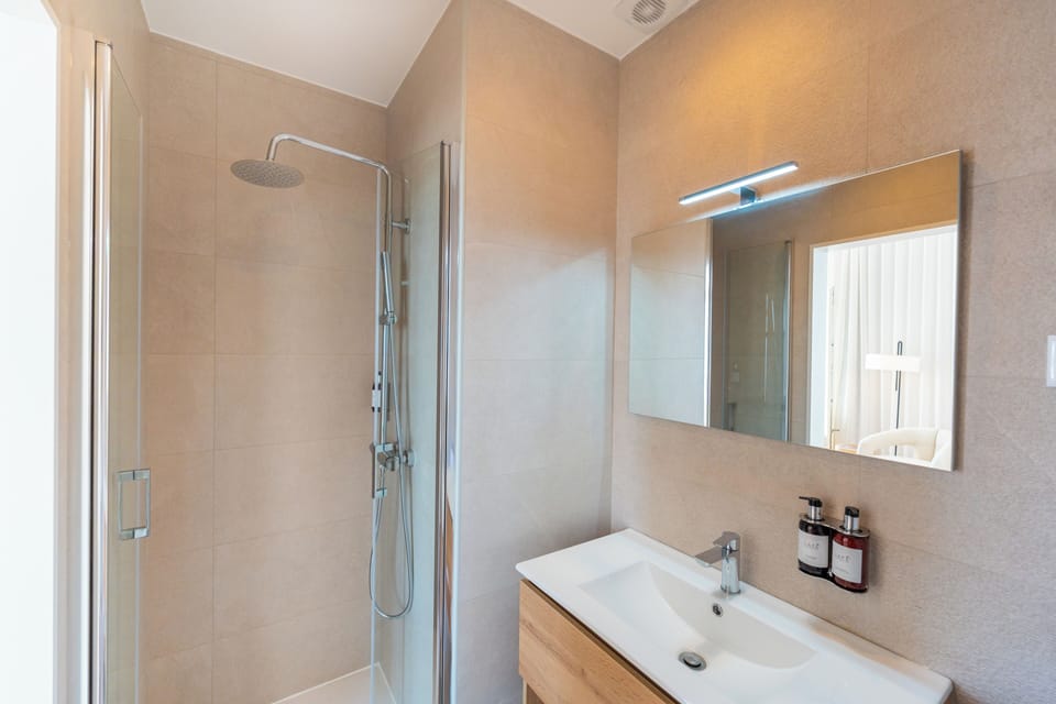Suite, Sea View | Bathroom | Shower, hair dryer, towels, soap