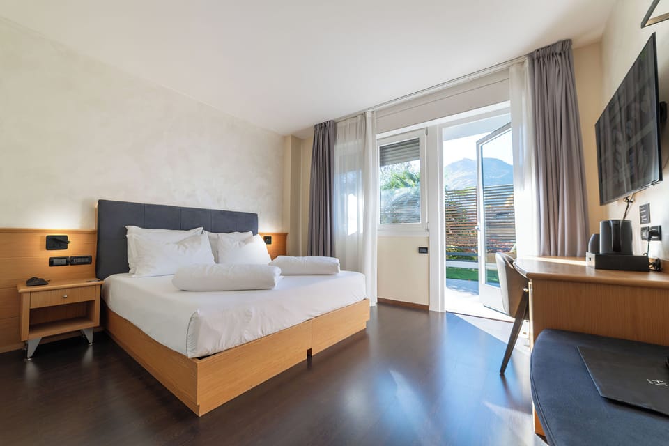 Family Comfort Room ,Patio | In-room safe, desk, WiFi (free), bed sheets