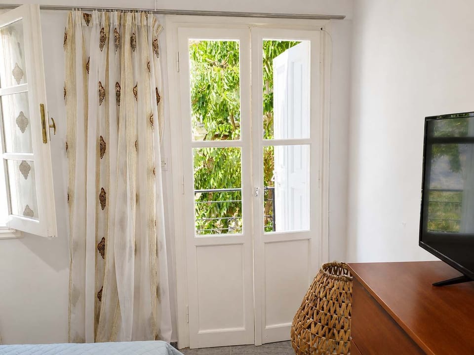 Quiet Bedroom with Garden-Facing Balcony Doors, Natural Daylight & Peaceful Atmosphere