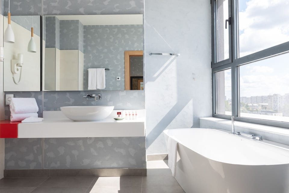 Suite, 1 King Bed, Non Smoking | Bathroom | Hair dryer, bathrobes, slippers, towels