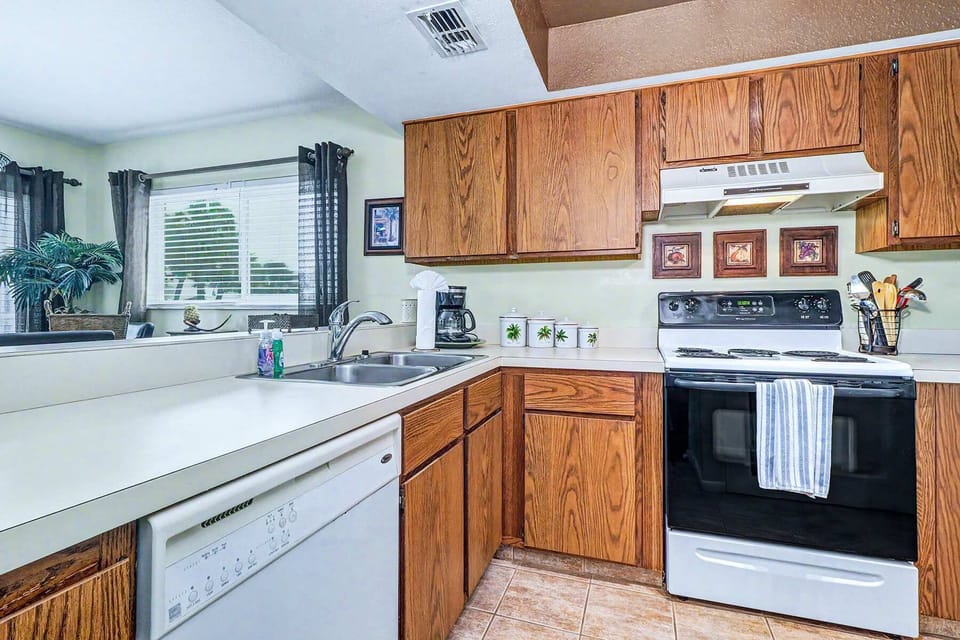 A full kitchen for the mornings you want a slow coffee and the evenings you'd rather cook than head out. Everything you need is here — range, oven, dishwasher, coffee maker, and enough counter space to actually use them.
