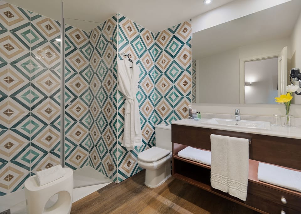 Shower, eco-friendly toiletries, hair dryer, bathrobes