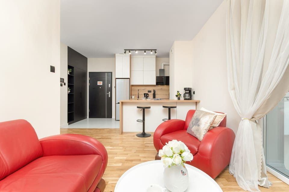 Alternative view of the living room with comfortable seating and direct access to the kitchen.