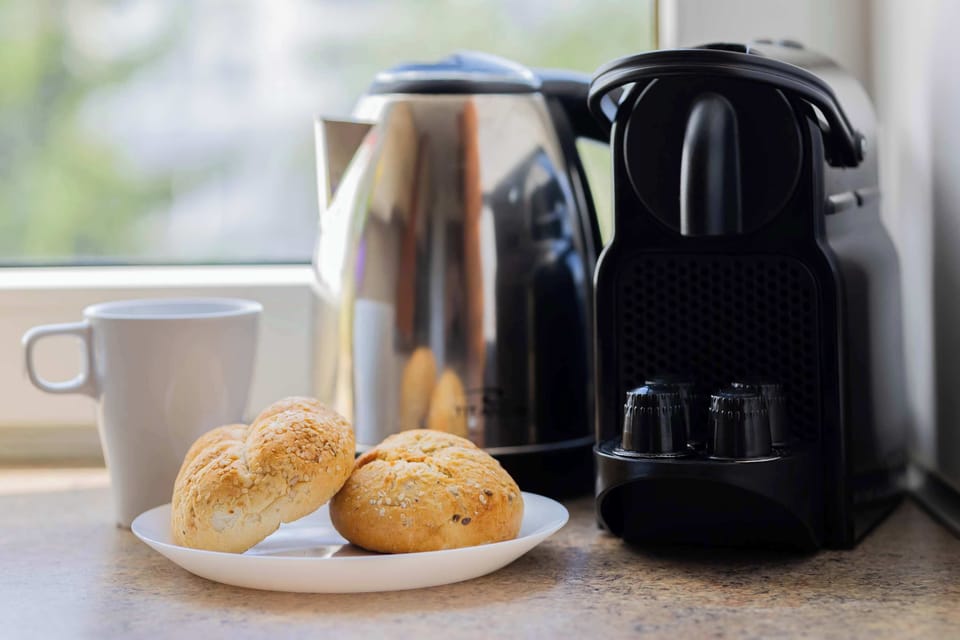 Coffee machine and electric kettle with complimentary coffee and tea for your convenience.