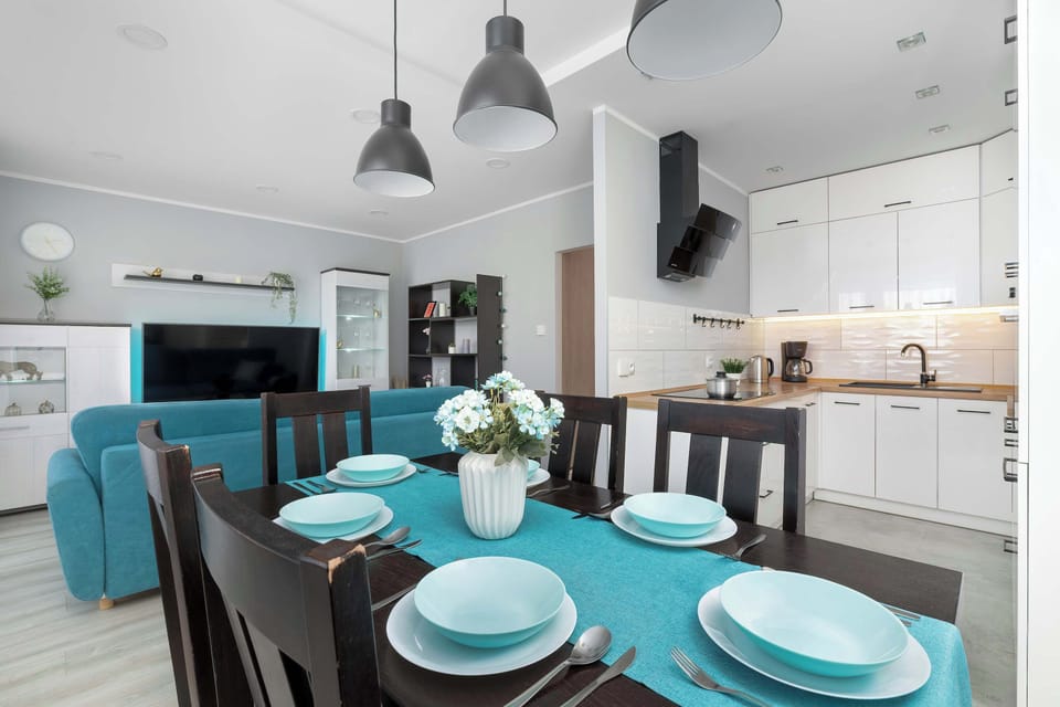 A cozy dining area connected to the kitchen with seating for four guests. It's an inviting place to enjoy breakfast, lunch, or dinner together.