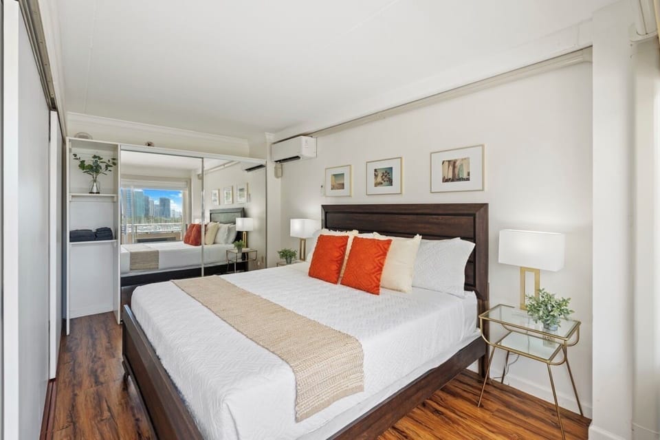 Main bedroom with accordion door utilized to create separate space from living area