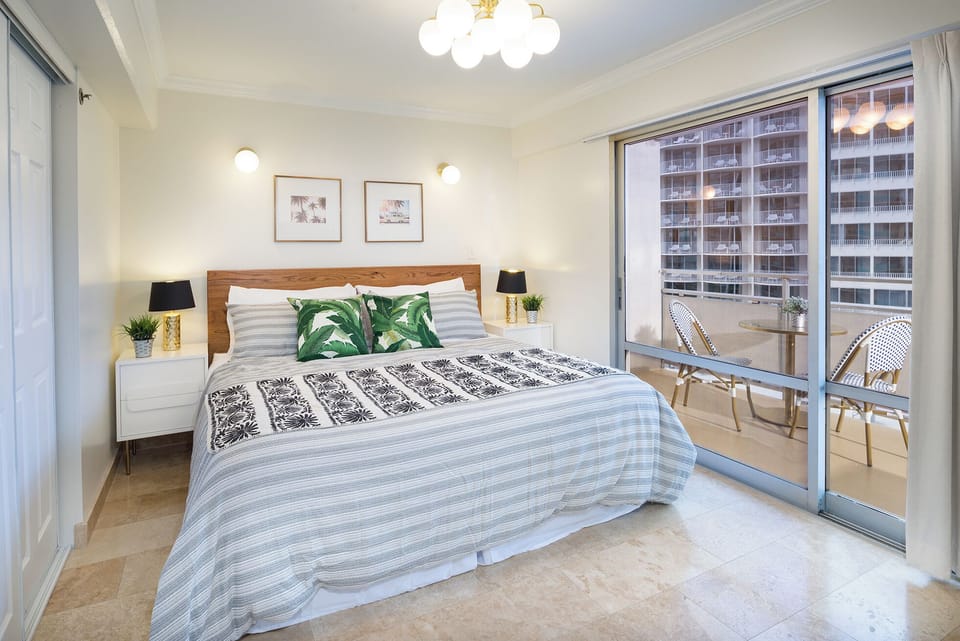 Bedroom 1 features a king bed (sleeps 2) and direct access to private lanai