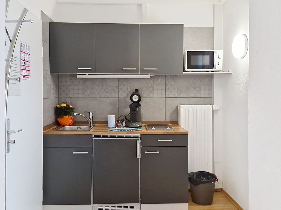 Kitchen Appliance, Kitchen, Countertop, Major Appliance, Kitchen Sink, Furniture, Cabinetry, Home Appliance, Kitchen Stove, Interior Design